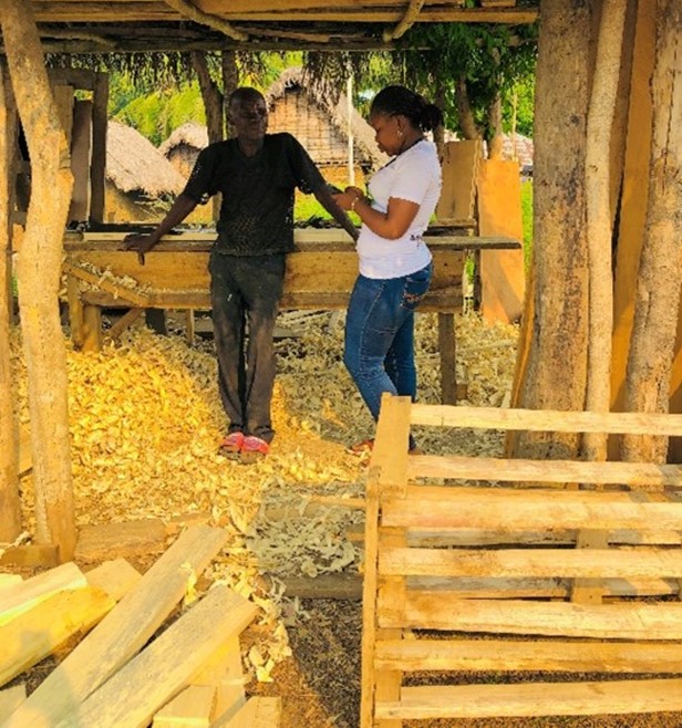 A team member interviewing a respondent who lives in Gegbwema Town 