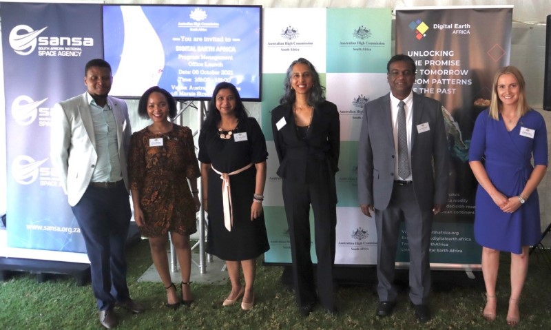 Attendees of the PMO launch Event in front of Digital Earth Africa banners