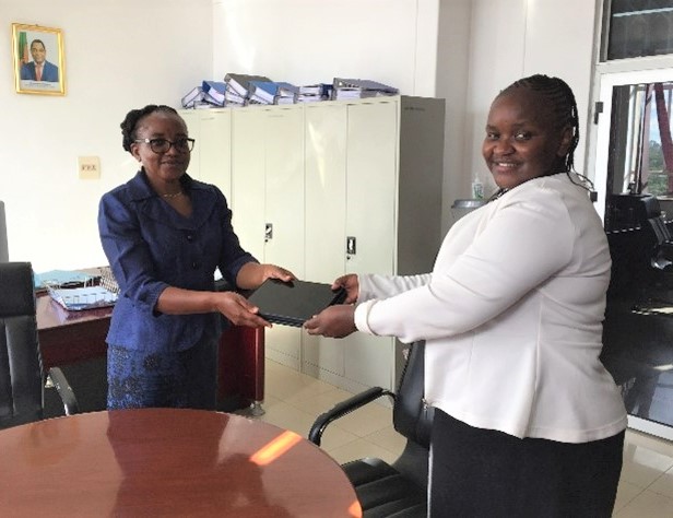 Mrs. Peggy Mlewa Director planning and policy of the ministry of Agriculture Zambia receiving Tablets from RCMRD Ag. GIS Manager Eunice Wangui